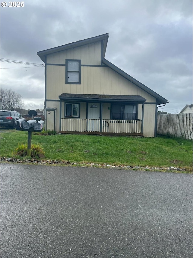 view of front of property with fence and a front yard