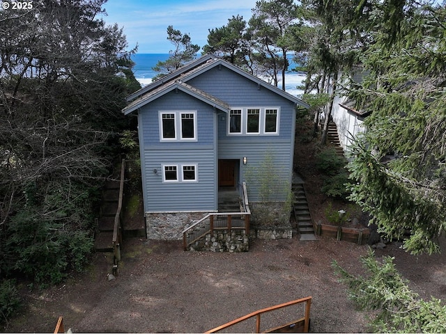 back of house with stairs