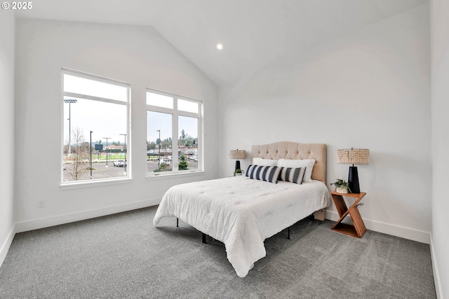 carpeted bedroom with vaulted ceiling