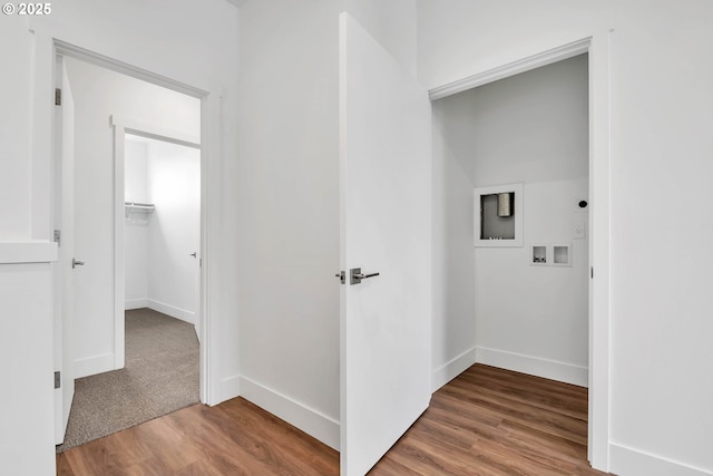 washroom featuring hookup for a washing machine and hardwood / wood-style flooring