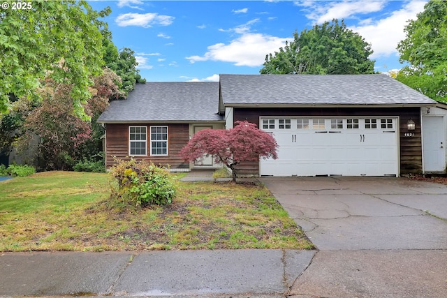 4021 N Clarey St, Eugene, OR 97402 - view of front of house with a garage, driveway, a front lawn, and a shingled roof