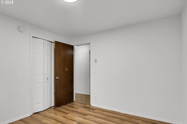 4021 N Clarey St, Eugene, OR 97402 - unfurnished bedroom with light wood-style flooring, baseboards, and a closet