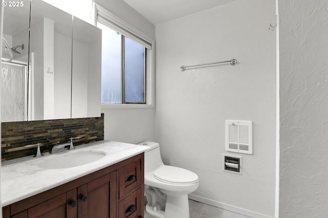 4021 N Clarey St, Eugene, OR 97402 - full bath featuring decorative backsplash, vanity, toilet, tile patterned floors, and a shower