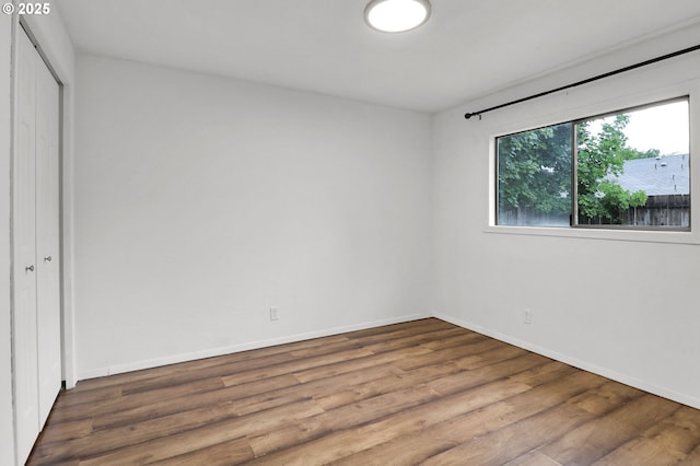 4021 N Clarey St, Eugene, OR 97402 - unfurnished bedroom featuring wood finished floors, baseboards, and a closet
