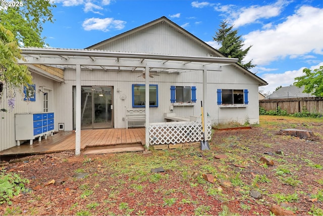4021 N Clarey St, Eugene, OR 97402 - rear view of property featuring fence, a deck, and a ceiling fan