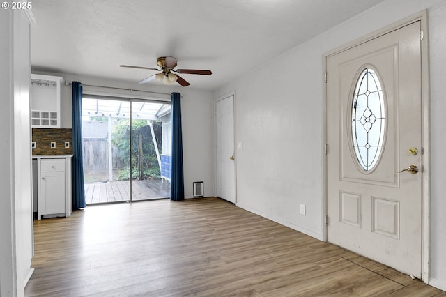 4021 N Clarey St, Eugene, OR 97402 - entryway with a ceiling fan, light wood-style floors, and baseboards