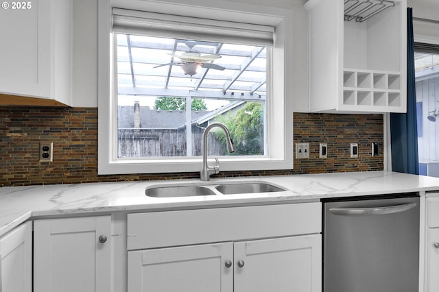 4021 N Clarey St, Eugene, OR 97402 - kitchen with dishwasher, a sink, decorative backsplash, and white cabinets