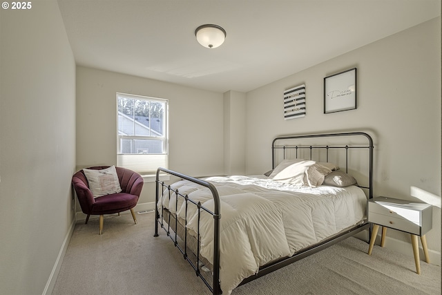 bedroom featuring light colored carpet