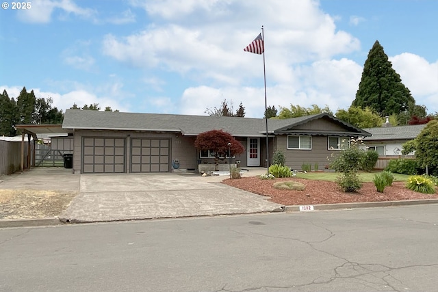 1082 Dondea St, Springfield, OR 97478 - view of front facade featuring a garage and driveway