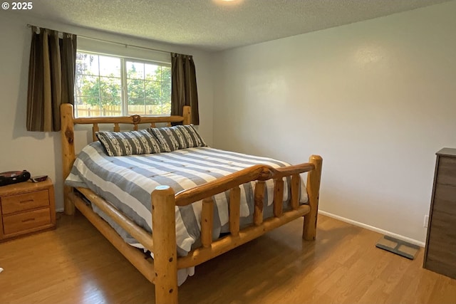 1082 Dondea St, Springfield, OR 97478 - bedroom with light wood-type flooring and a textured ceiling