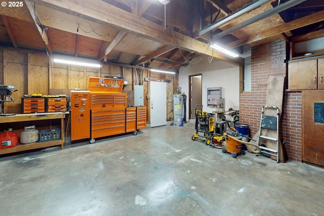 1082 Dondea St, Springfield, OR 97478 - garage featuring a workshop area, electric water heater, and electric panel