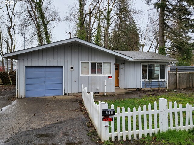 ranch-style house featuring a garage