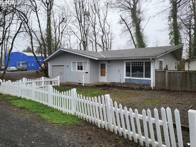 ranch-style home featuring a garage