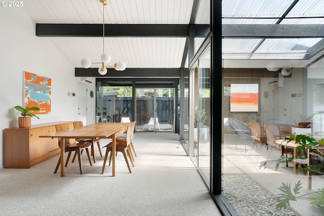 carpeted dining area with vaulted ceiling with beams