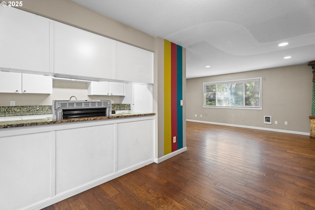 11255 SW Springwood Dr, Portland, OR 97223 - kitchen with white cabinets, recessed lighting, dark wood-type flooring, dark stone countertops, and open floor plan