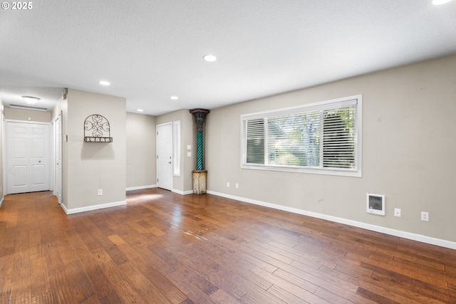 11255 SW Springwood Dr, Portland, OR 97223 - spare room featuring wood-type flooring, recessed lighting, and heating unit