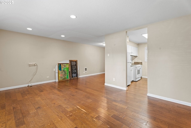 11255 SW Springwood Dr, Portland, OR 97223 - unfurnished living room with hardwood / wood-style floors and recessed lighting