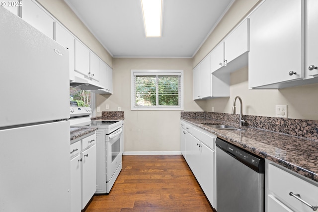 11255 SW Springwood Dr, Portland, OR 97223 - kitchen with white appliances, under cabinet range hood, dark wood finished floors, white cabinetry, and ornamental molding