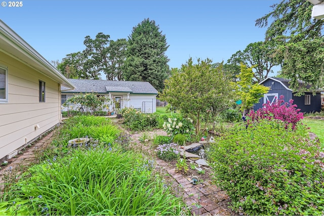 157 NE 11th Dr, Hillsboro, OR 97124 - view of yard featuring a storage shed and an outdoor structure