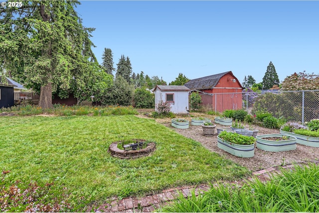 157 NE 11th Dr, Hillsboro, OR 97124 - view of yard featuring a garden, an outbuilding, a storage shed, and a barn