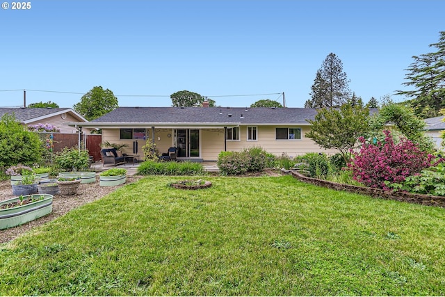 157 NE 11th Dr, Hillsboro, OR 97124 - rear view of house with a vegetable garden and a patio
