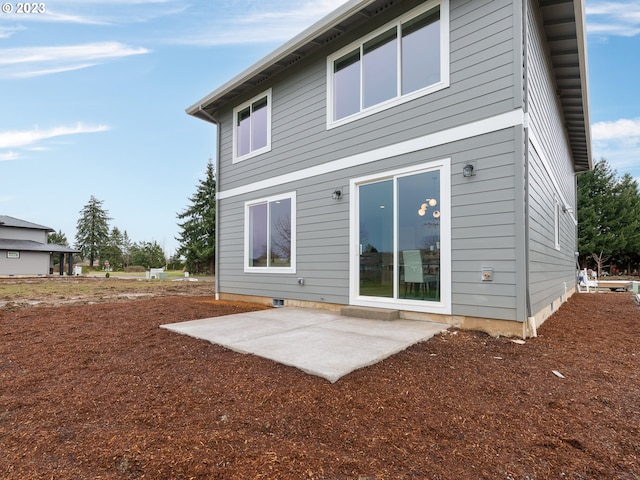 rear view of property with a patio area