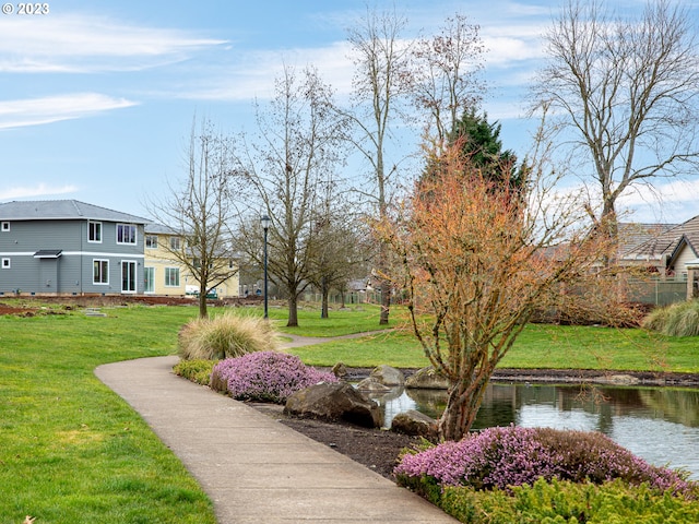 surrounding community featuring a yard