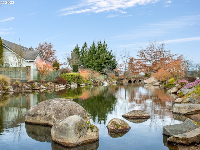 view of water feature featuring fence