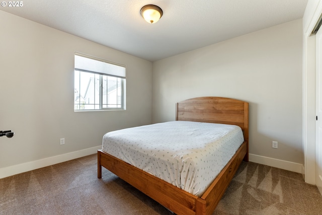 carpeted bedroom with baseboards