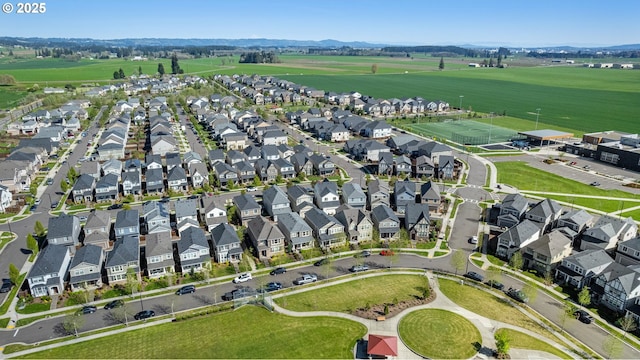 drone / aerial view featuring a residential view and a mountain view