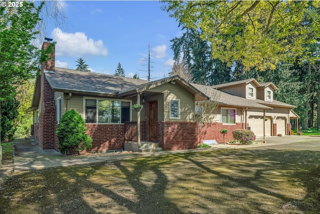 view of front of house with a garage, brick siding, a chimney, and a shingled roof