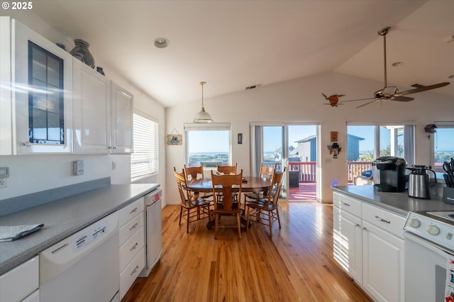 kitchen featuring pendant lighting, white appliances, light hardwood / wood-style floors, white cabinets, and vaulted ceiling