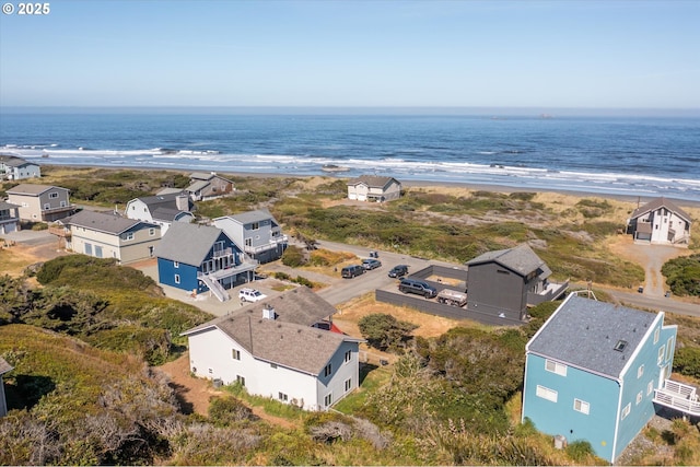 aerial view with a beach view and a water view