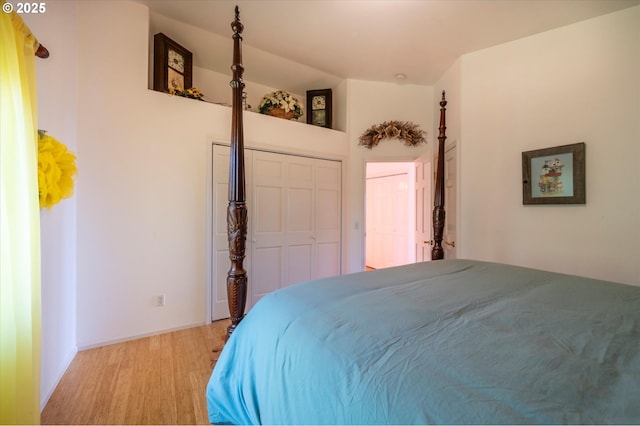 bedroom with light wood-type flooring and a closet