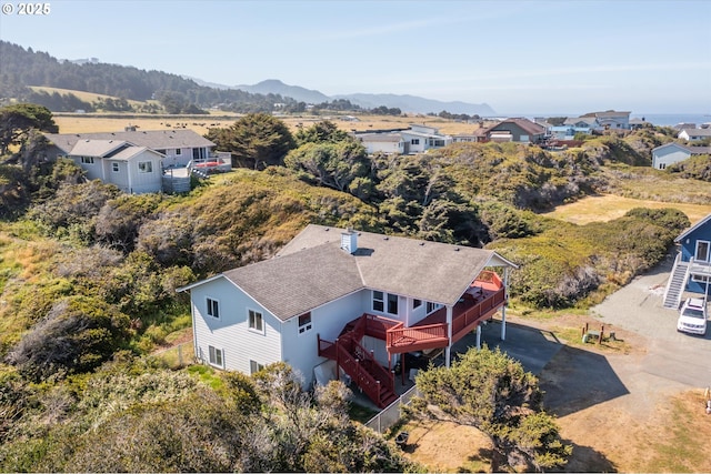 birds eye view of property with a mountain view