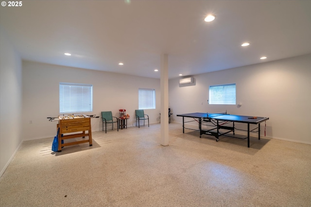 recreation room with a wall mounted air conditioner