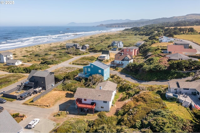 aerial view with a water view and a view of the beach