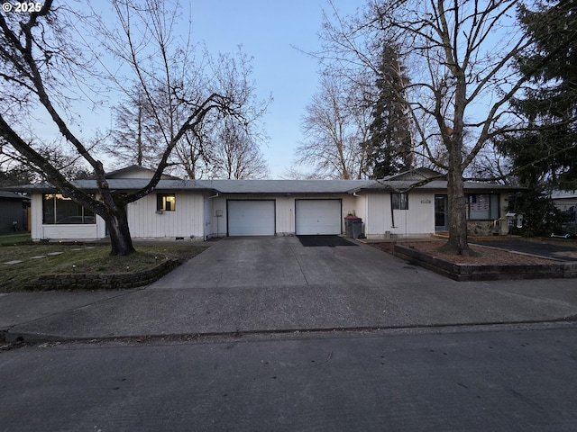 ranch-style house featuring a garage