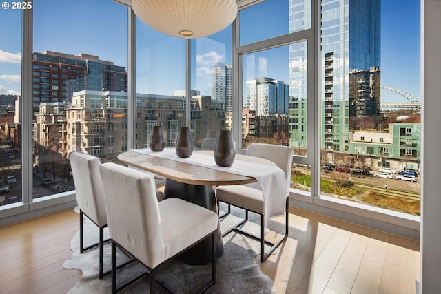 sunroom / solarium featuring a city view