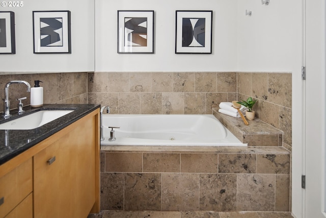 bathroom featuring vanity and a jetted tub