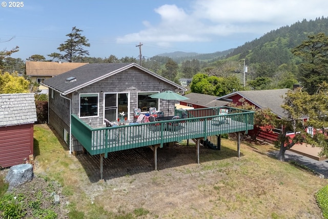 4345 Salem Ave, Neskowin, OR 97149 - rear view of house with a deck with mountain view, a yard, and stairway