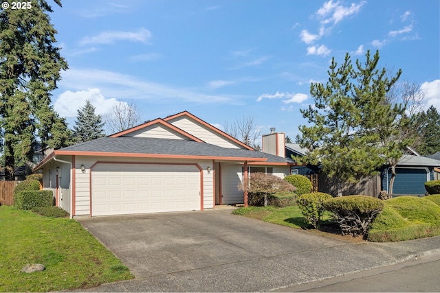 single story home featuring a garage, concrete driveway, a front yard, and fence