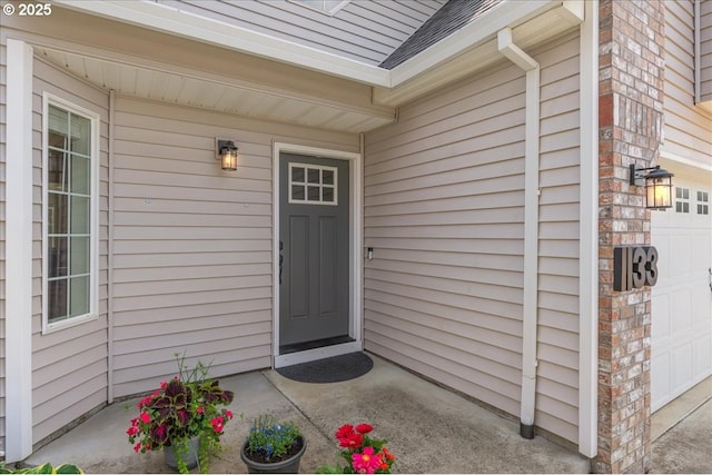 1133 7th St, Lafayette, OR 97127 - view of exterior entry with a shingled roof and brick siding