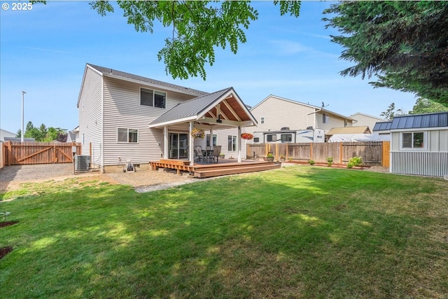 1133 7th St, Lafayette, OR 97127 - back of property with a wooden deck, a fenced backyard, and an outdoor structure