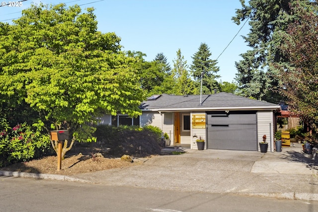 7335 SE 48th Ave, Portland, OR 97206 - view of front of property with driveway and a garage