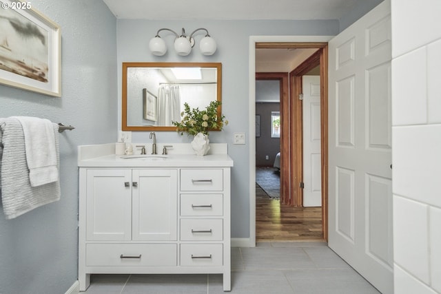 7335 SE 48th Ave, Portland, OR 97206 - full bathroom with vanity, tile patterned floors, and baseboards