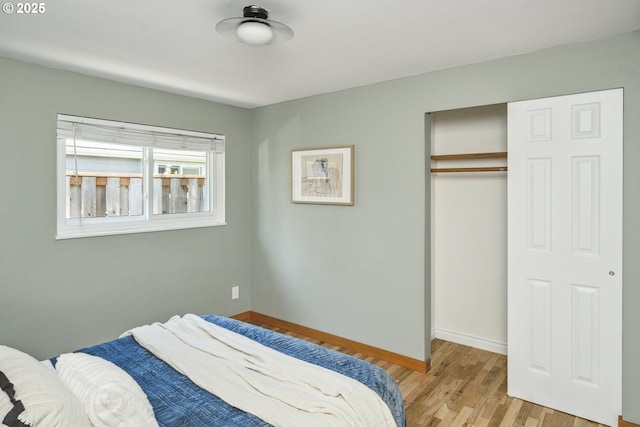 7335 SE 48th Ave, Portland, OR 97206 - bedroom with light wood-type flooring, a closet, and baseboards