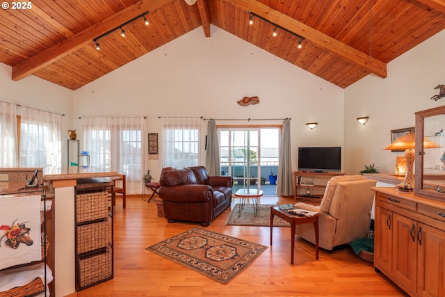 1327 Village Loop, Bandon, OR 97411 - living area with light wood-type flooring, a healthy amount of sunlight, beam ceiling, and wooden ceiling