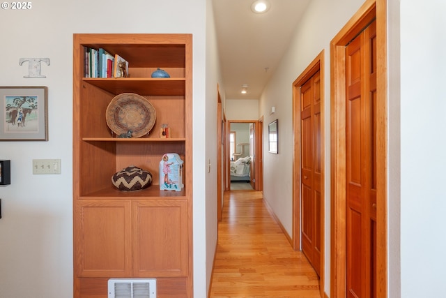 1327 Village Loop, Bandon, OR 97411 - hall featuring visible vents, built in features, baseboards, recessed lighting, and light wood-style flooring