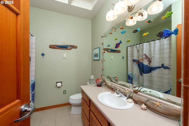 1327 Village Loop, Bandon, OR 97411 - full bath with vanity, baseboards, tile patterned flooring, toilet, and a skylight